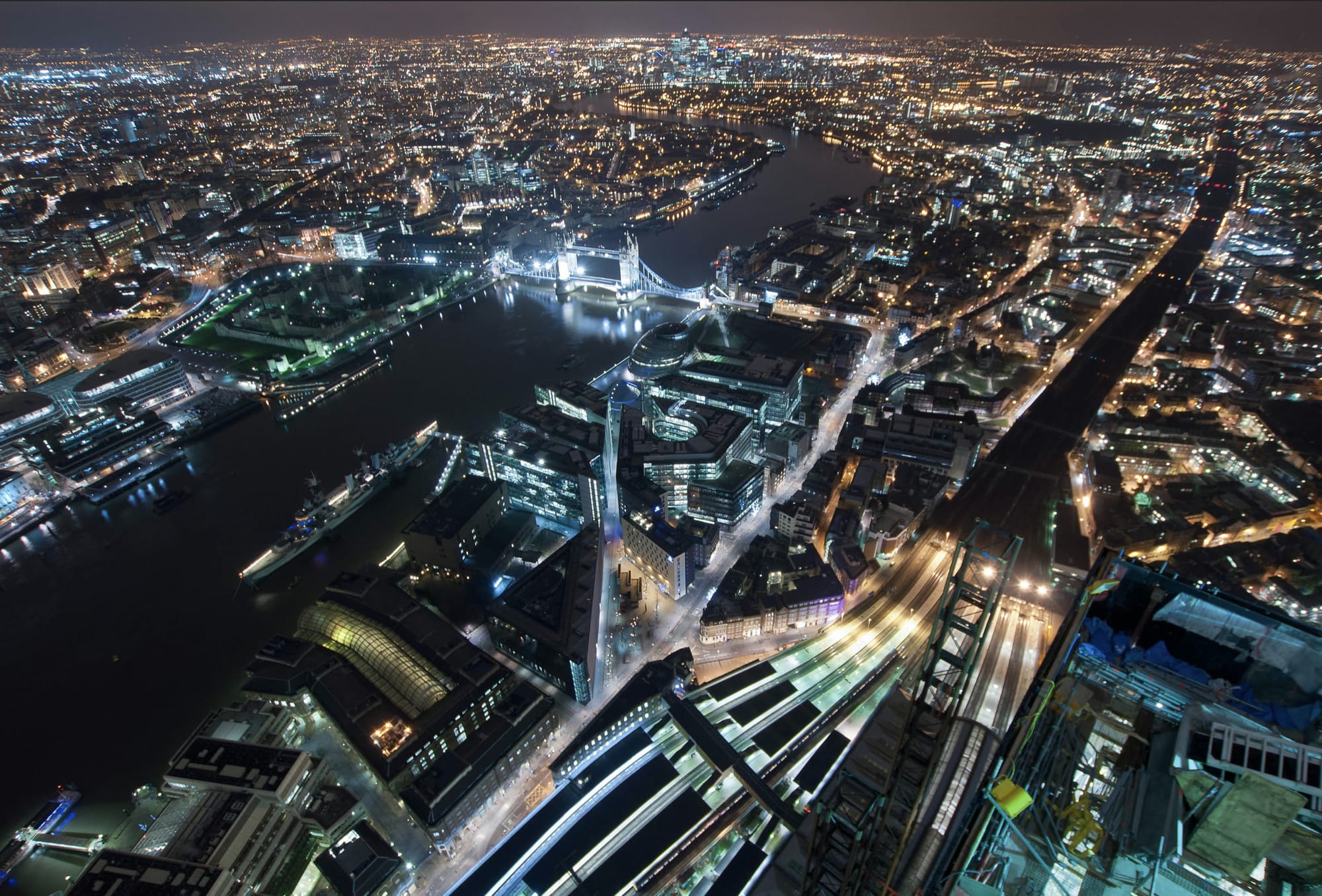 Bradley Garrett's night photograph from the upper structure of the Shard during its construction, London lit up far below