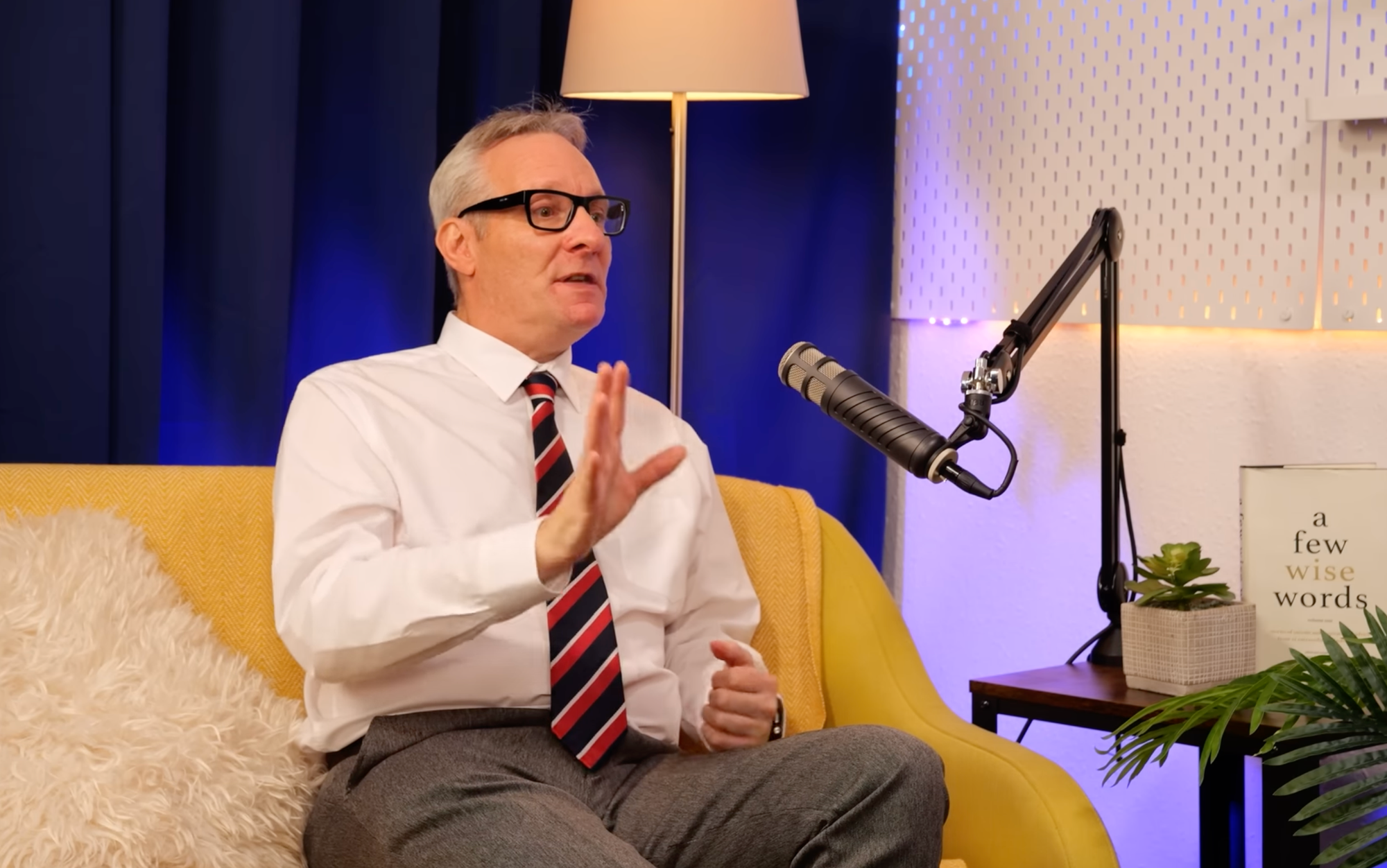 Philip Kinsella gesturing as he makes a point at the microphone during his BEYOND interview
