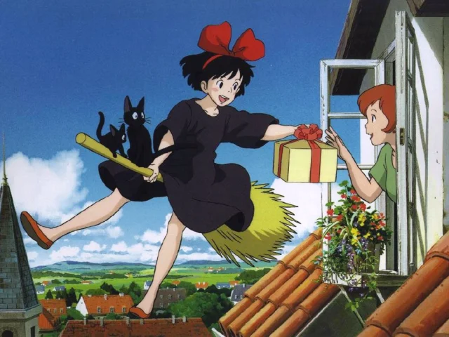 Kiki's Delivery Service: Young witch Kiki rides on her broom with two black cats. Flying above the rooftops, she hands a present to a woman reaching out an open window.