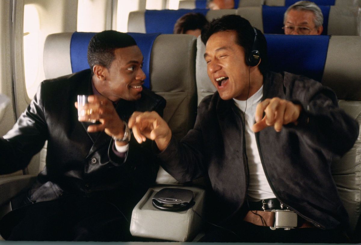 Chris Tucker and Jackie Chan it on an airplane in a scene from Rush Hour