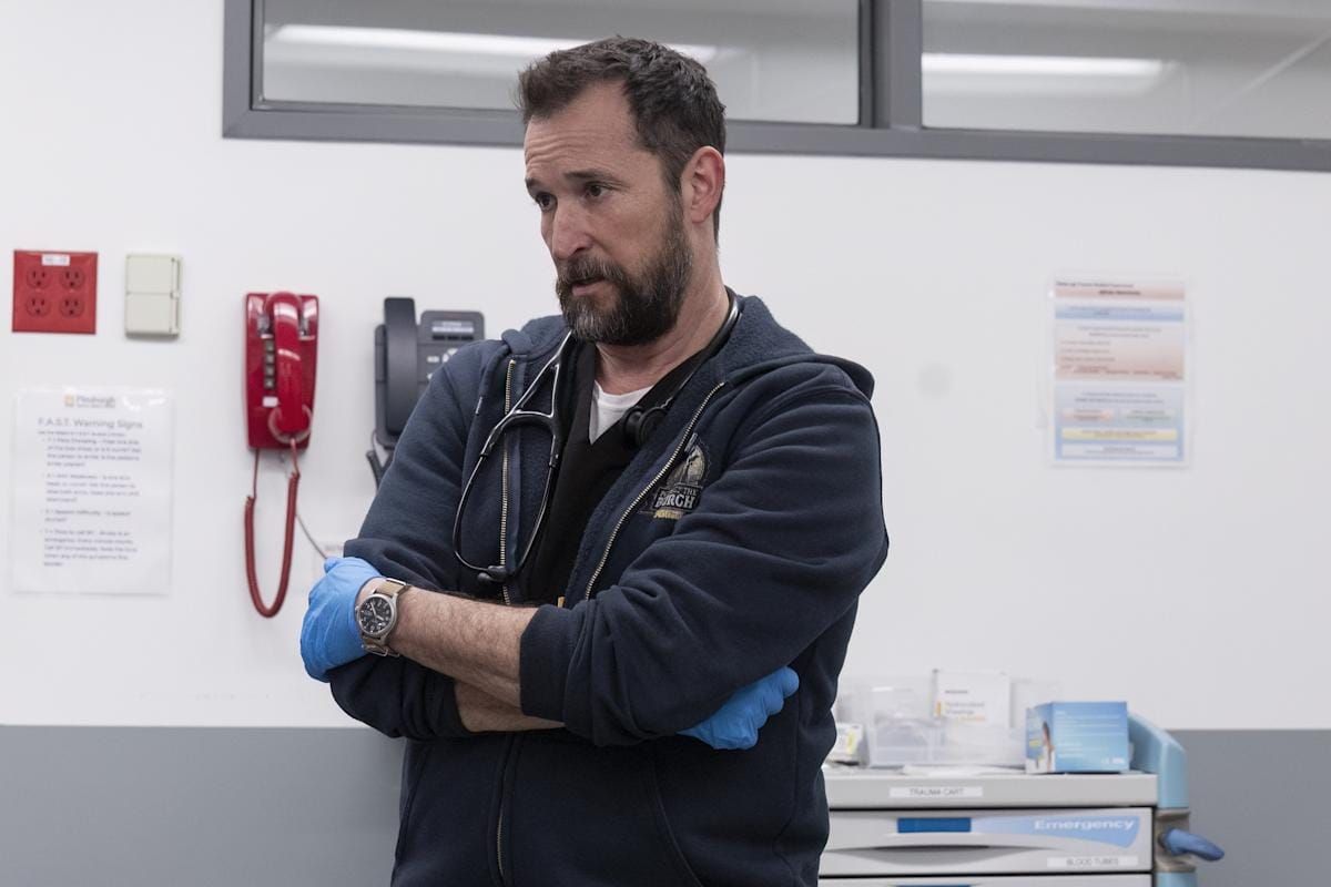 The Pitt: In an exam room, Dr. Robby crosses his arms and makes that face where you know Dad's not mad, he's disappointed, and that's worse.