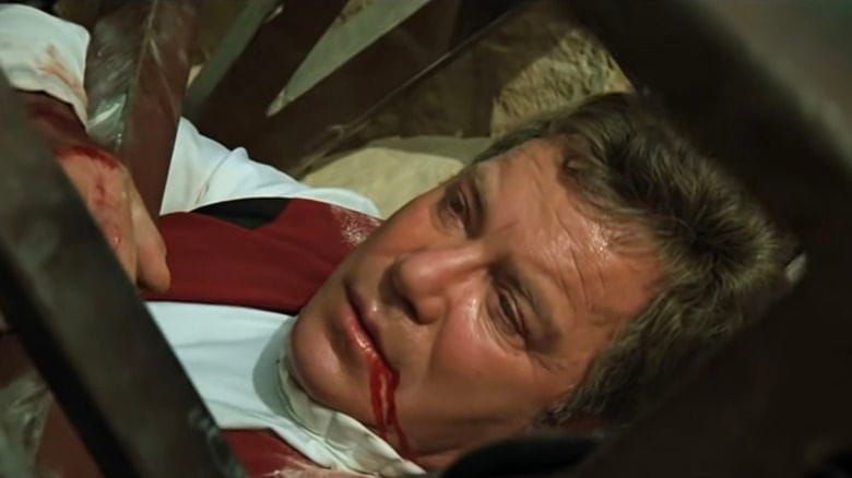 Star Trek Generations: James T. Kirk lies under a collapsed metal bridge, blood on his face, but still somehow ready to talk and talk and talk...