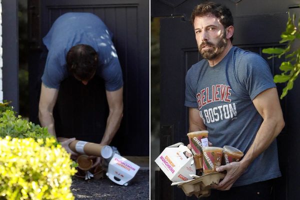 Ben Affleck drops several coffees and looks at the camera with pure shame