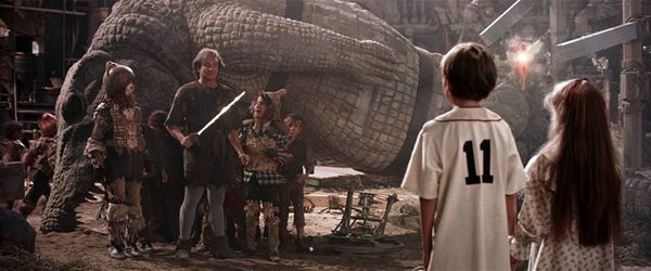 Peter Pan played by Robin Williams looks at his kids in a scene from Hook (1991)
