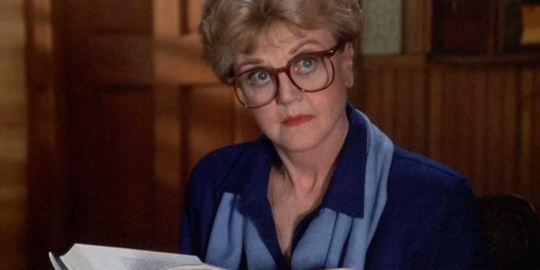 Murder, She Wrote: Jessica Fletcher wearing glasses while looking up from a book.