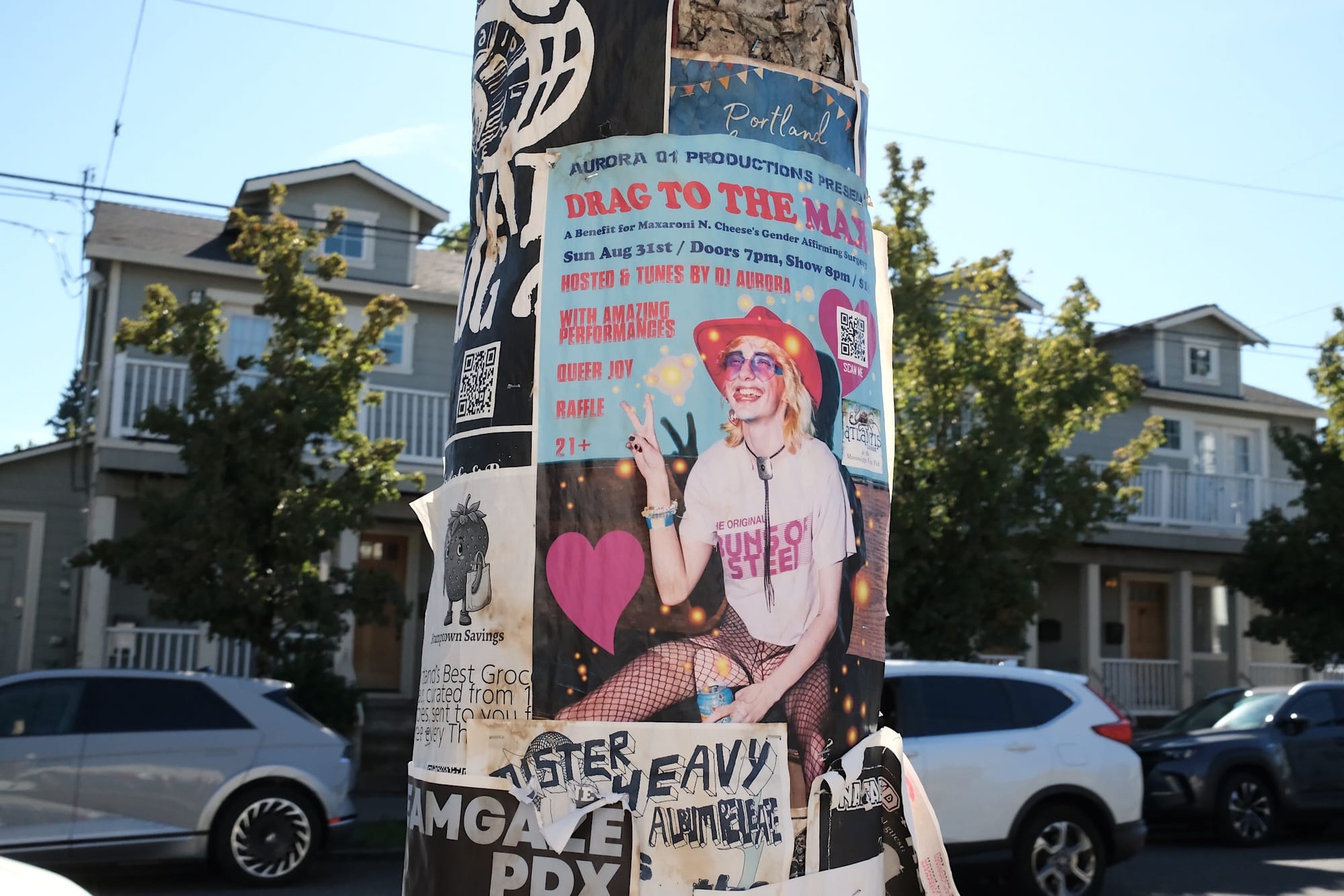 A poster advertises a drag show with the headline "Drag to the max."