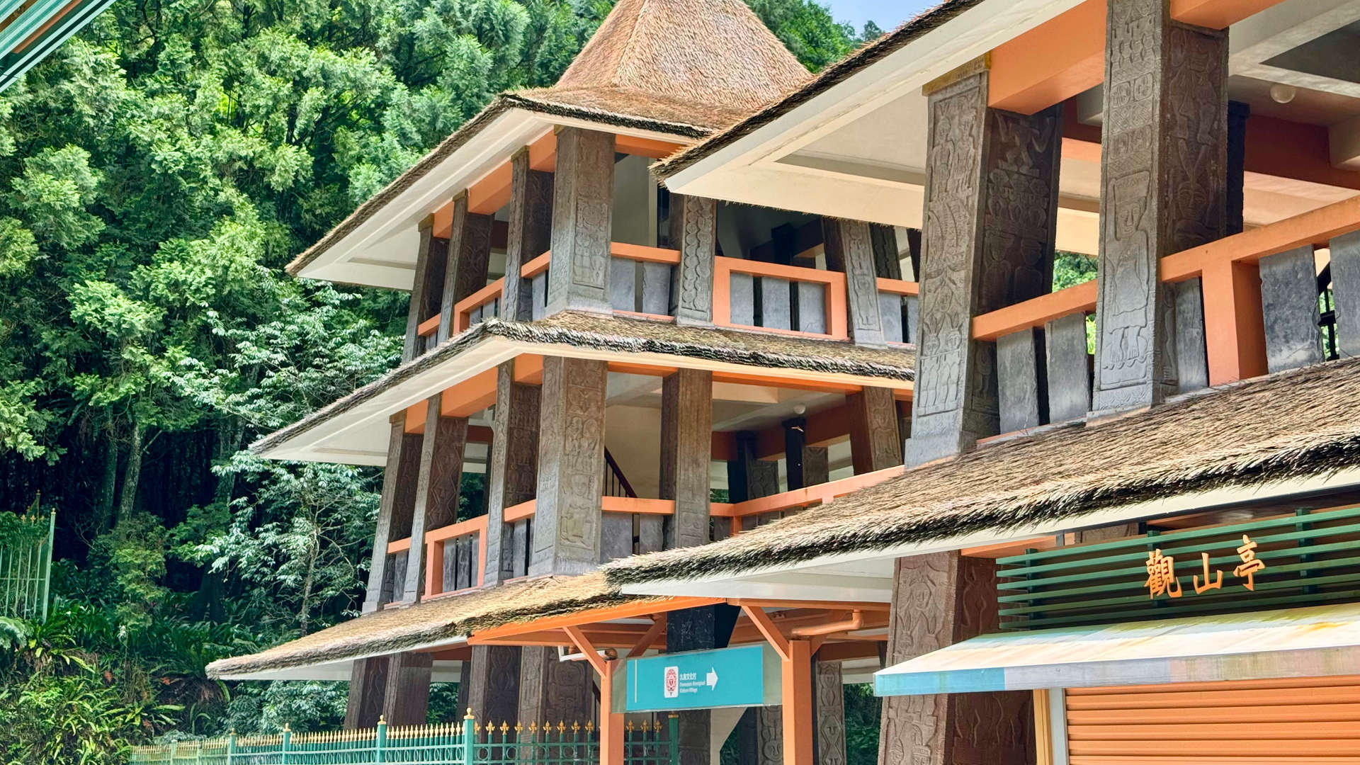 Three-story indigenous architecture marking the entrance to an aboriginal theme park in Taiwan.