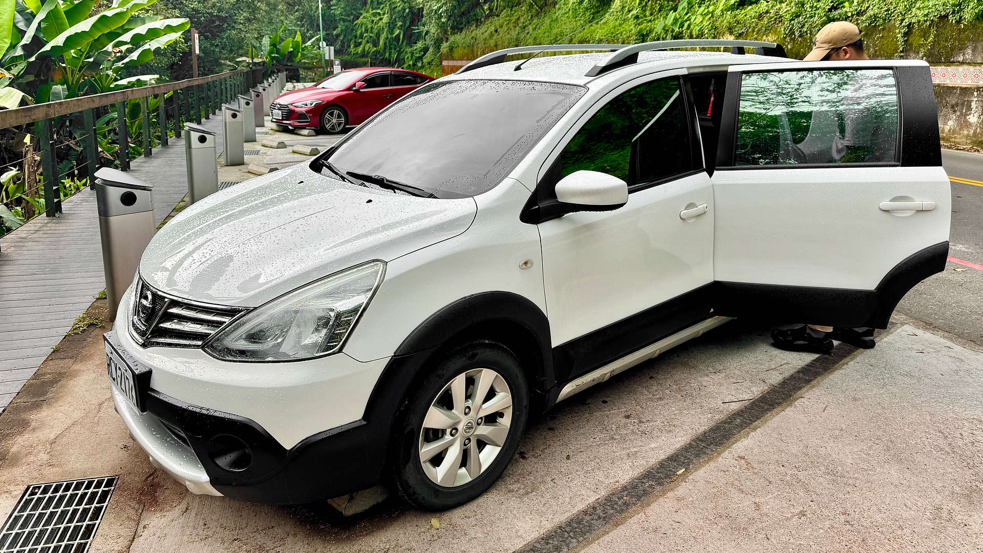 A Nissan Livina X-Gear car parked in the rain near Sun Moon Lake, Taiwan.