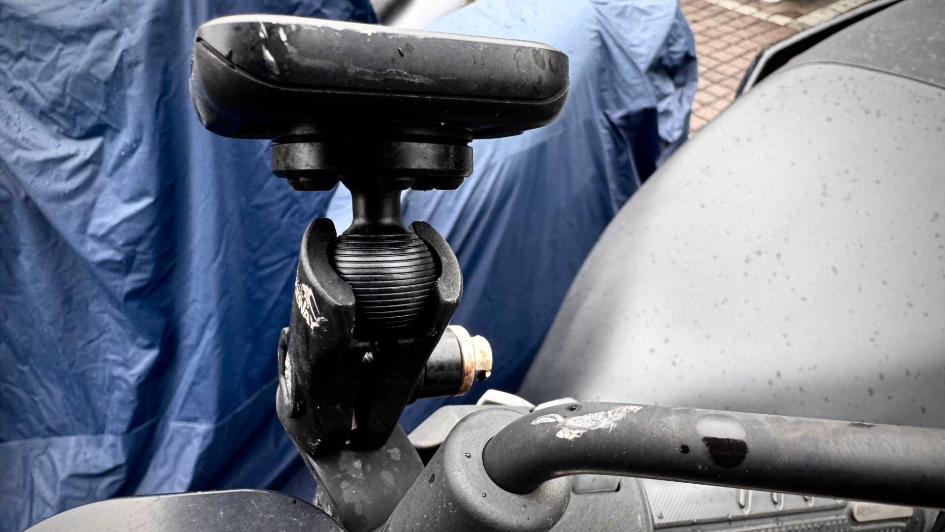 Scratches on a scooter’s Peak Design phone mount, Takeway phone mount base structure, and mirror arm.