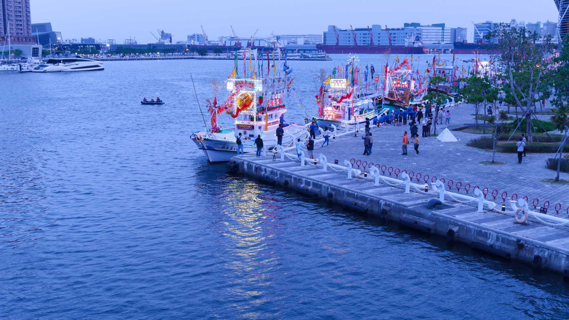 The front-most fishing boat docked at Love Pier. It is brightly decorated.
