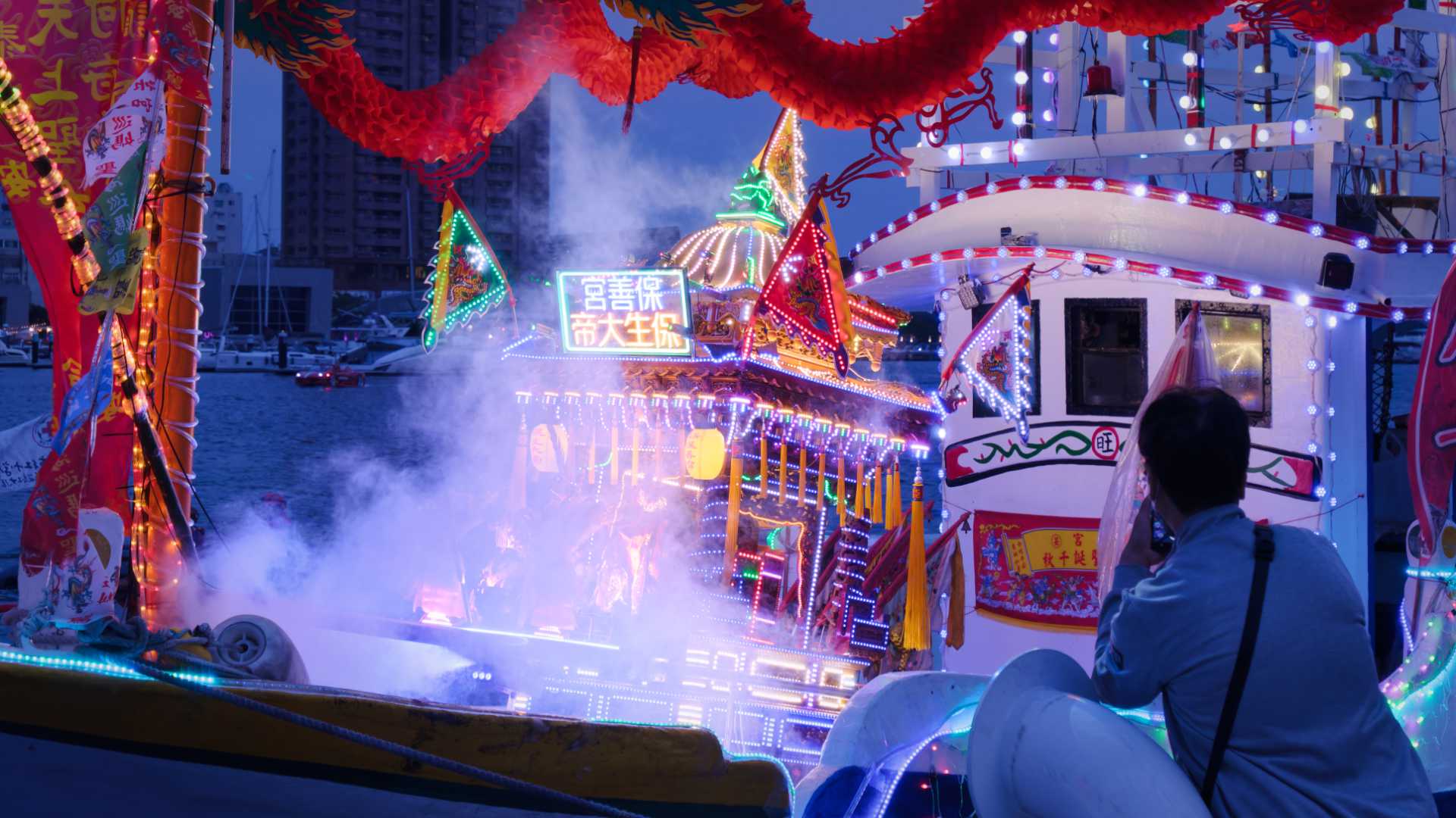 Smoke coming from below a shrine box on a Taiwanese fishing boat.