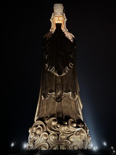 A 48-meter tall golden statue of the sea goddess Mazu, taken at night, on the main Penghu Island in Taiwan.