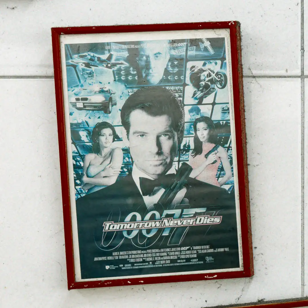 Vintage framed poster for the 1997 James Bond movie Tomorrow Never Dies.