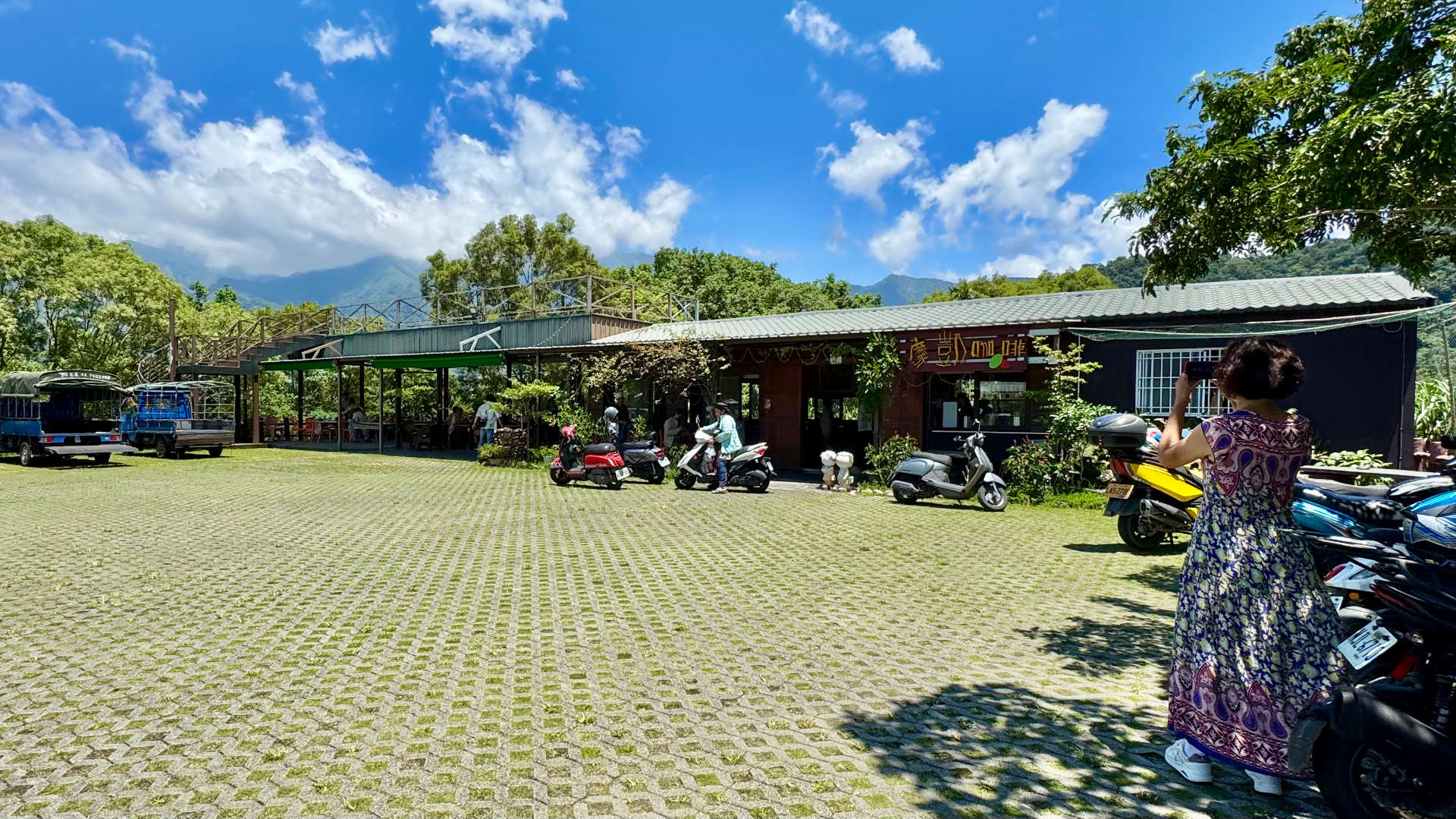 Wutai Mo Kai Cafe, a cafe with a large shaded outdoor seating area.