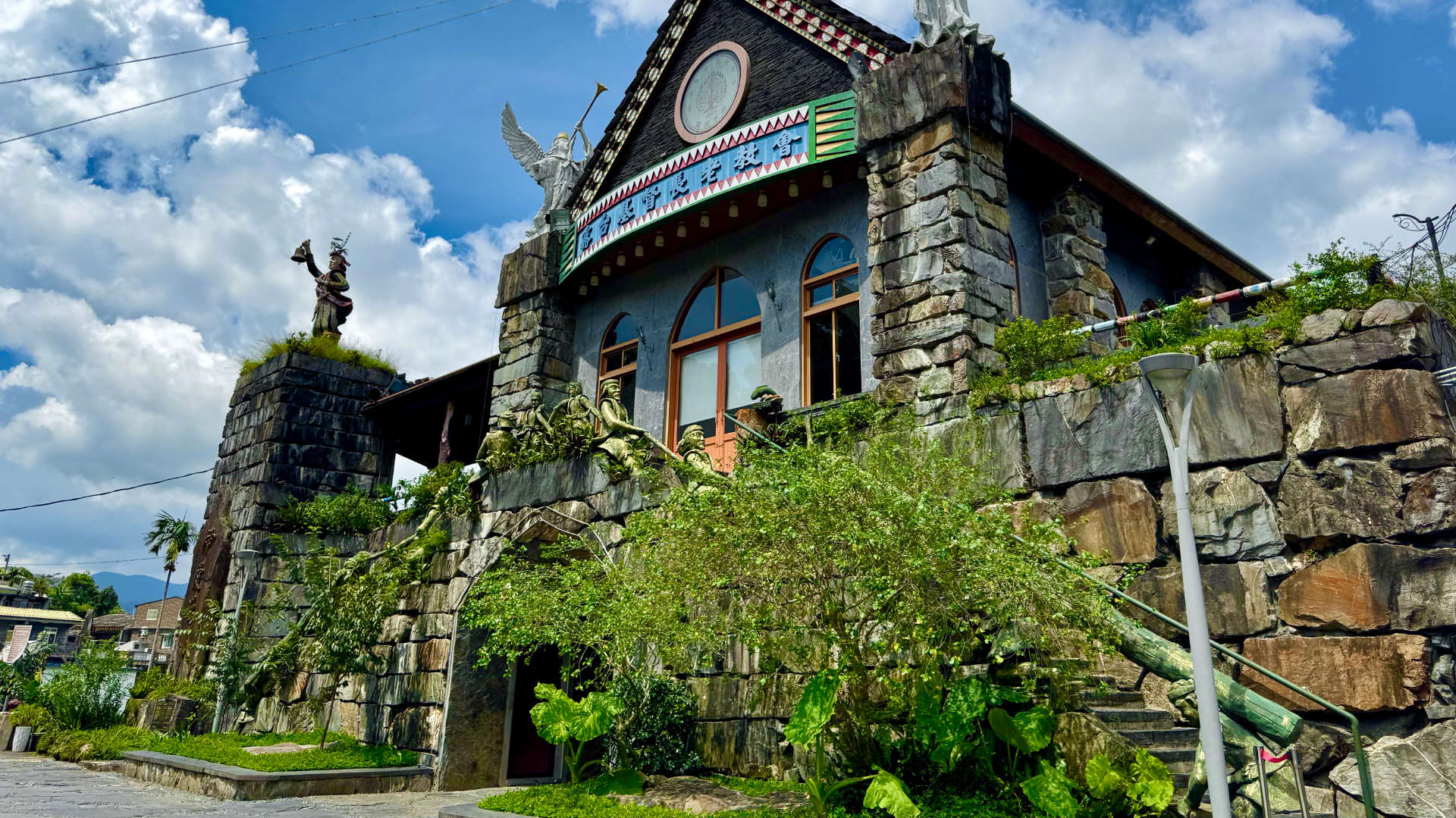 A church made of stone, decorated with indigenous sculptures and patterns.