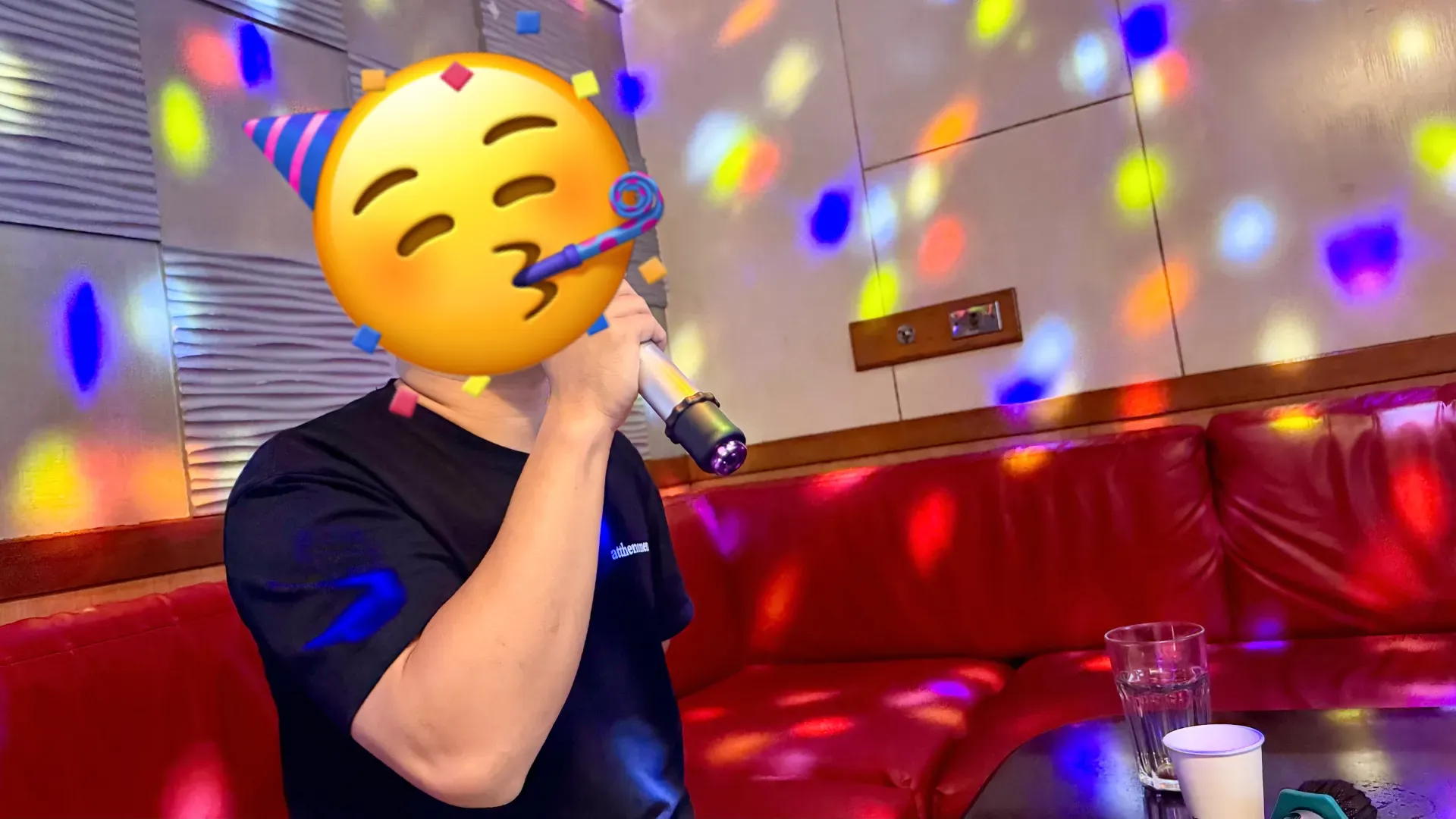 A man enthusiastically singing a KTV song in Kaohsiung, Taiwan.