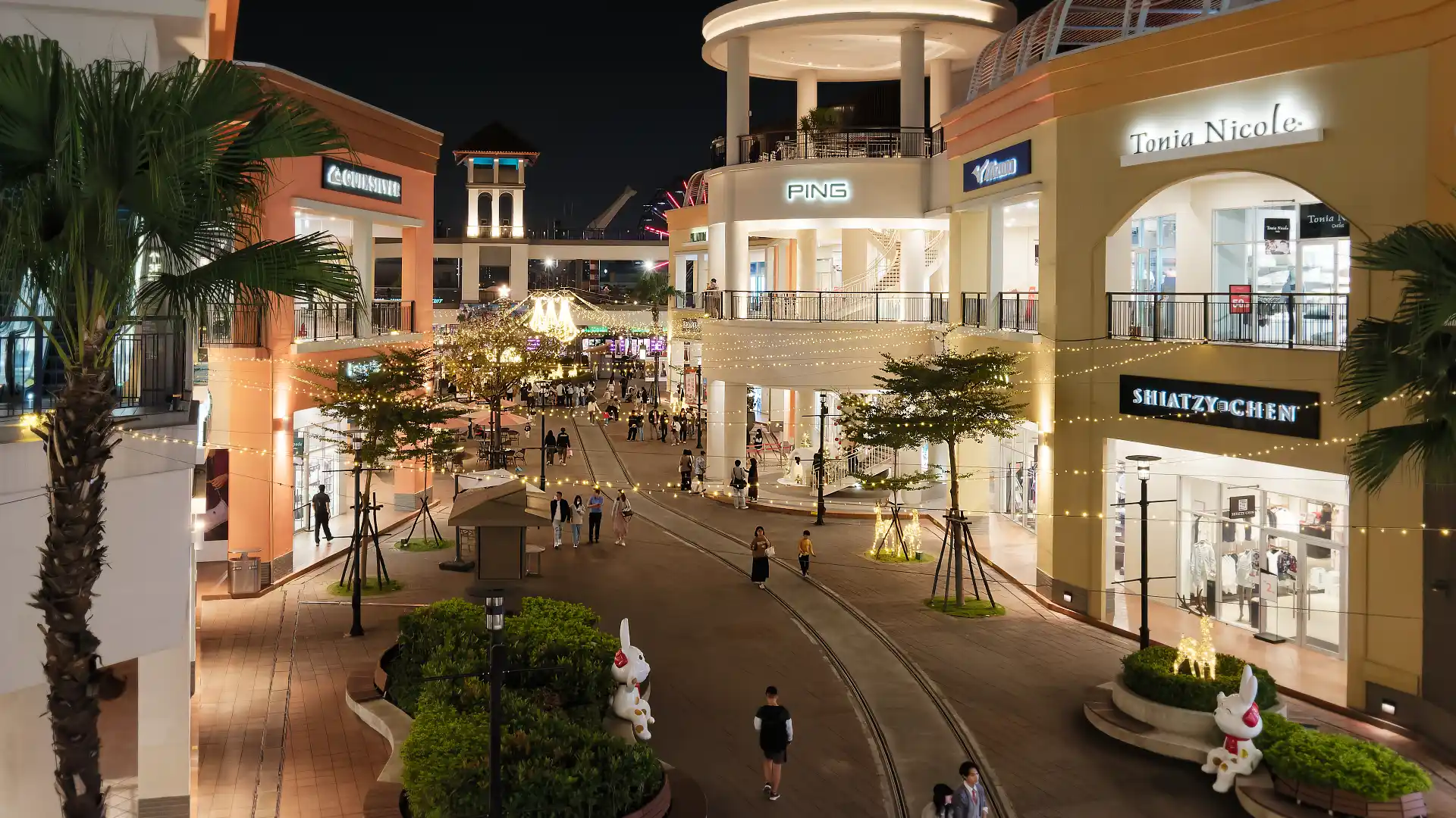 Festoon lights hanging over an outdoor square at SKM Park shopping mall in Kaohsiung, Taiwan.