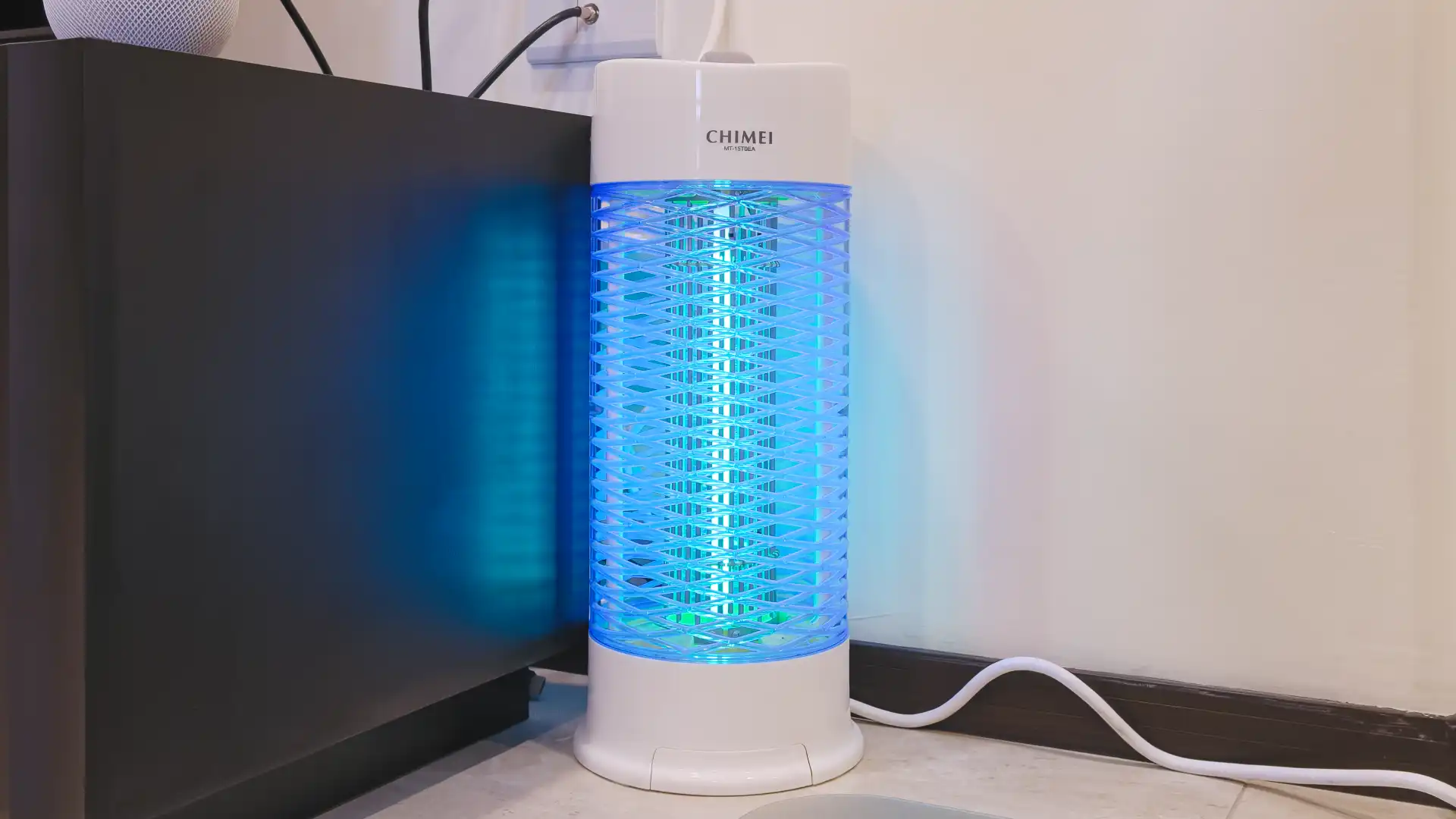 A Taiwanese bright blue mosquito lamp in a living room.