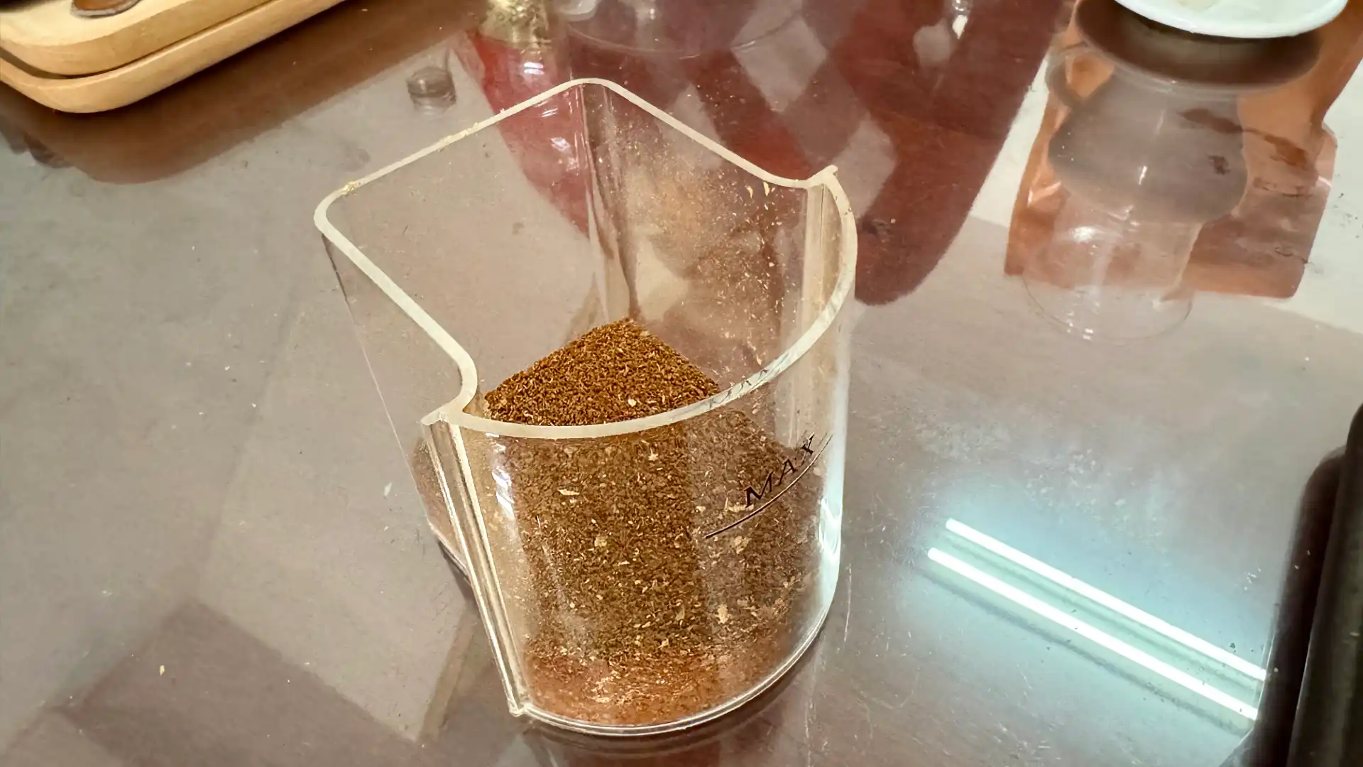 A container of ground coffee beans.