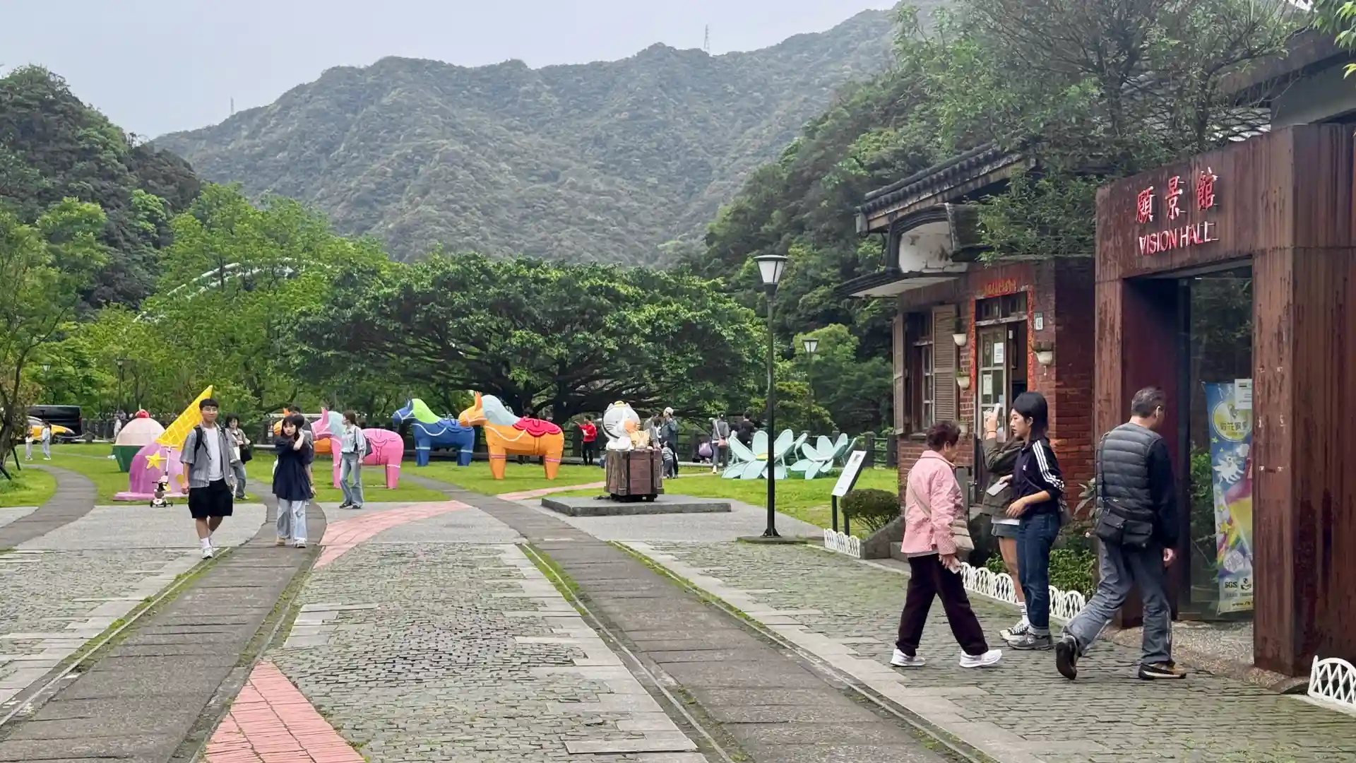 People in the village square at Houtong.