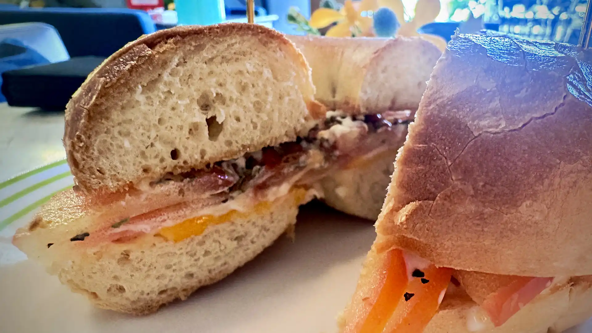 Close-up of a freshly-prepared tomato bagel.