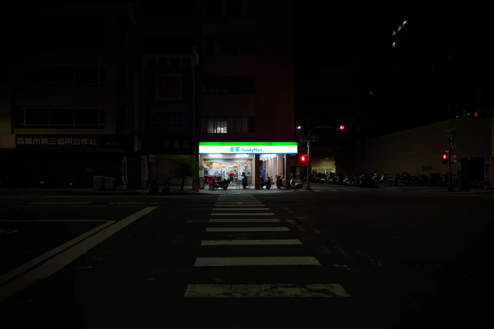 A FamilyMart convenience store in Taiwan at night.