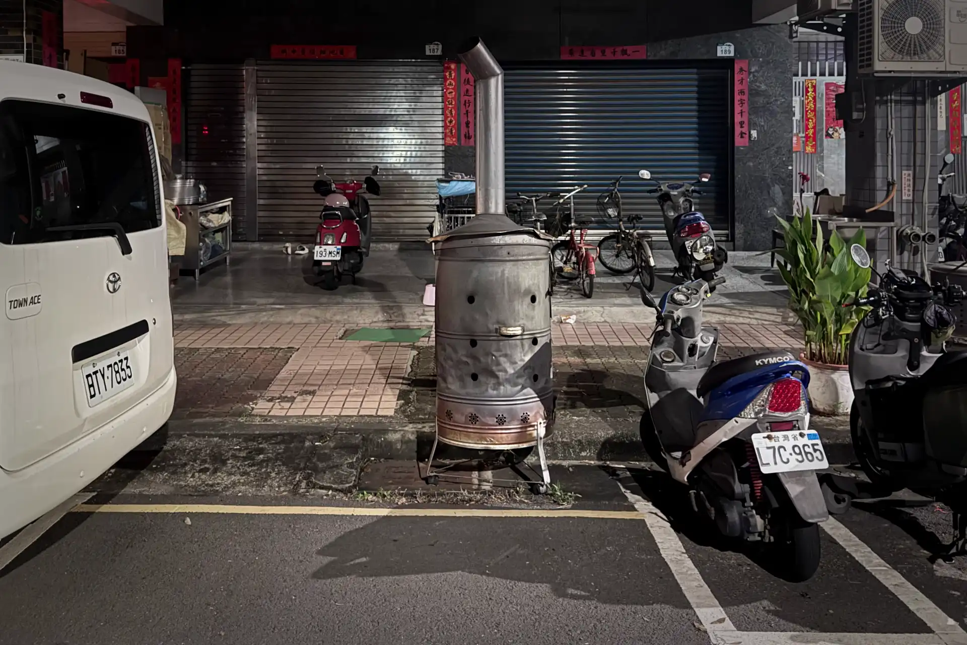 A furnace on a sidewalk, around 60 cm wide and 1.2 meters tall.