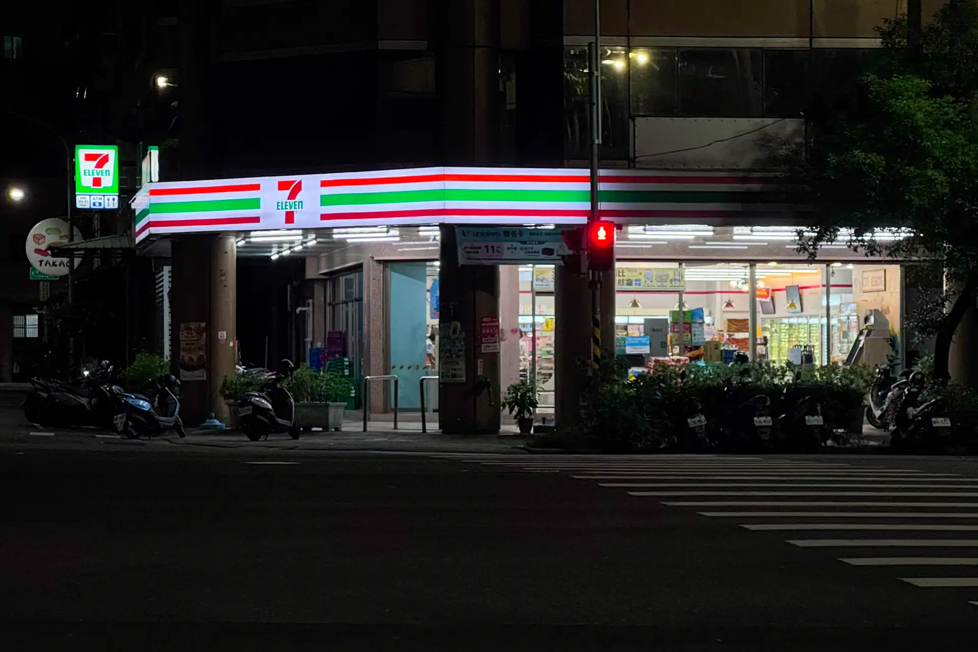 A 7-Eleven convenience store in Taiwan at night.