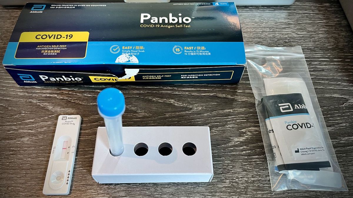 A ‘Panbio’ COVID-19 Antigen Self-Test kit, showing a negative result on the test device, plus other kit contents.