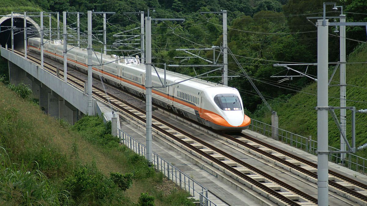 A Taiwan High Speed Rail bullet train exiting a tunnel.