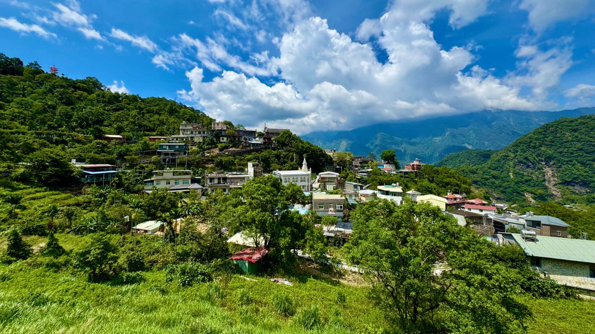 Wide-angle shot of Wutai Township on a sunny day, nestled amongst the Pingtung mountains of Taiwan.