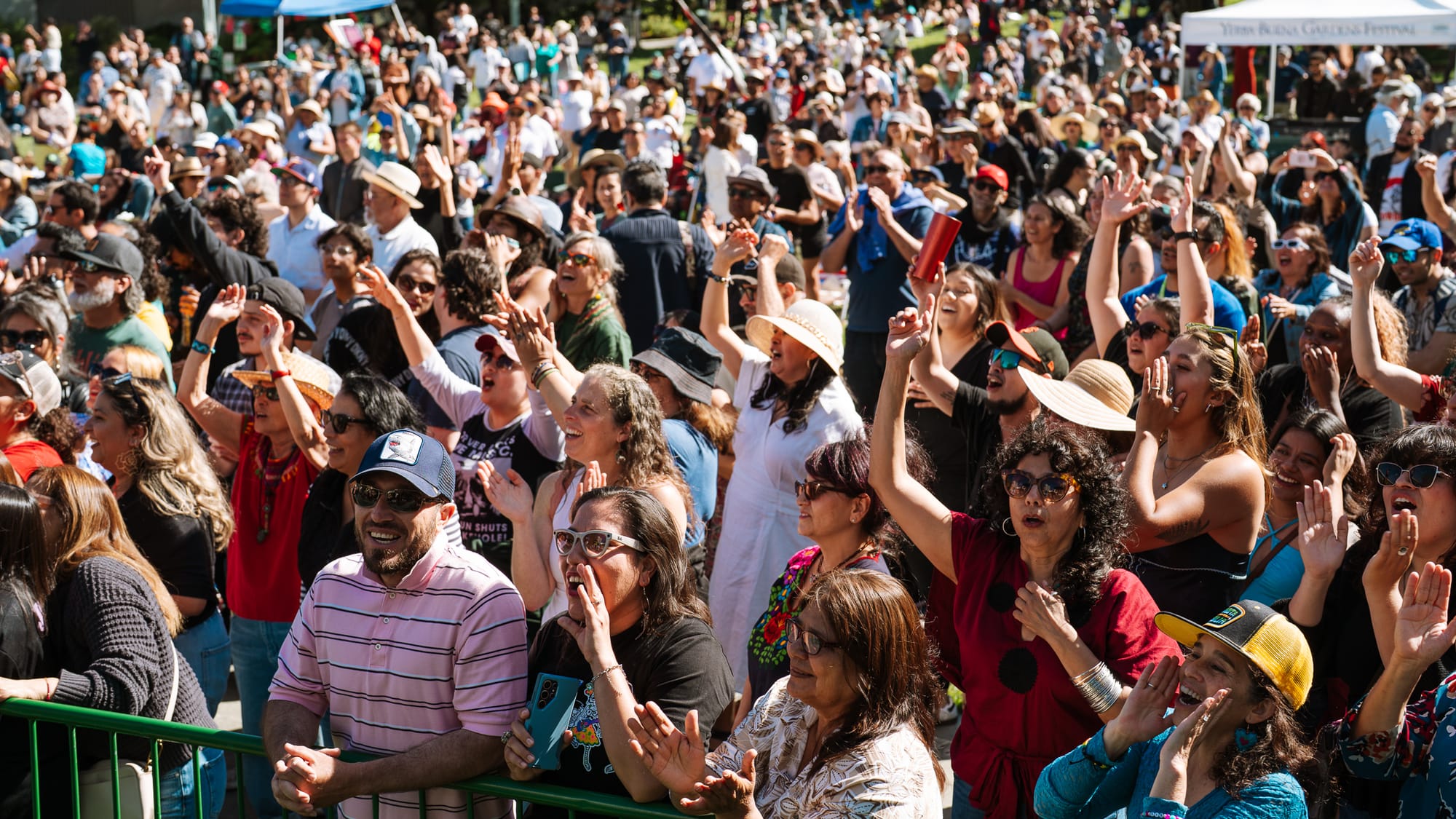 Audience members applauding and dancing at Yerba Buena Gardens Festival