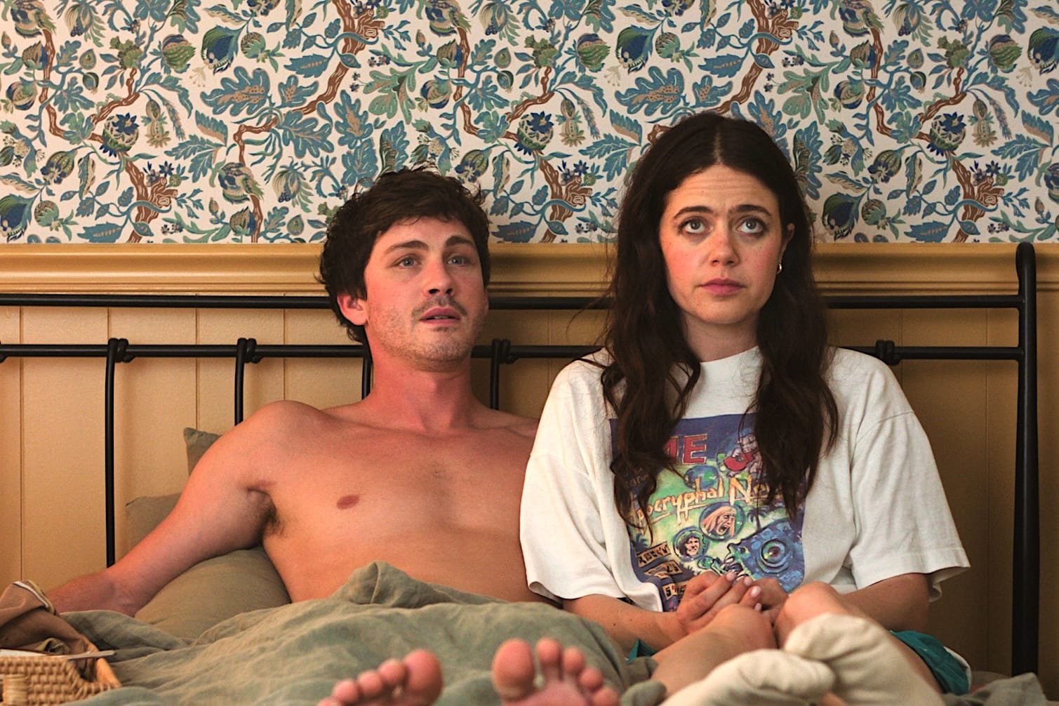 Two stars of movie "Oh, Hi!" in bed together, looking sheepish 