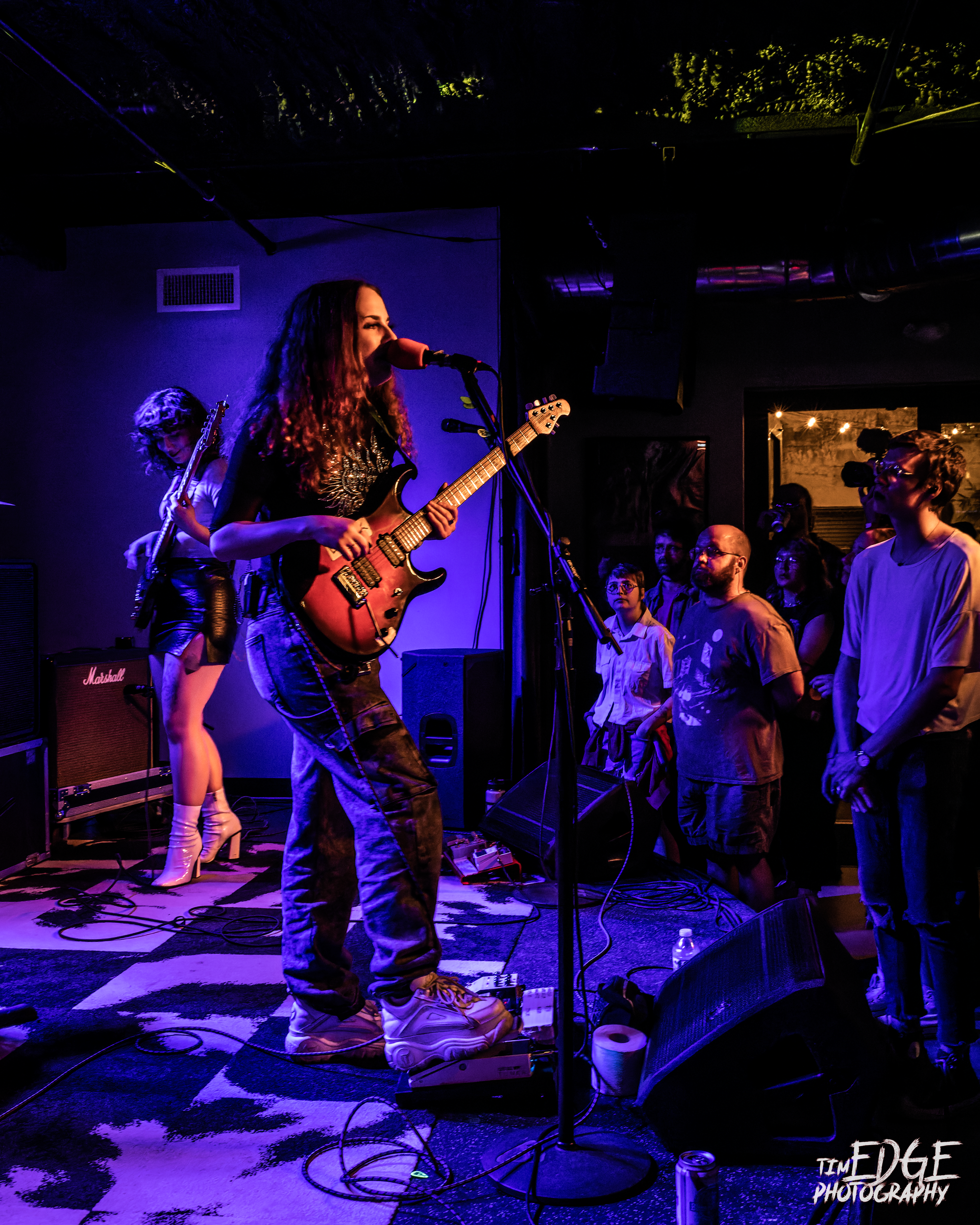 Christine Goodwyne of Pool Kids on stage at The Handlebar