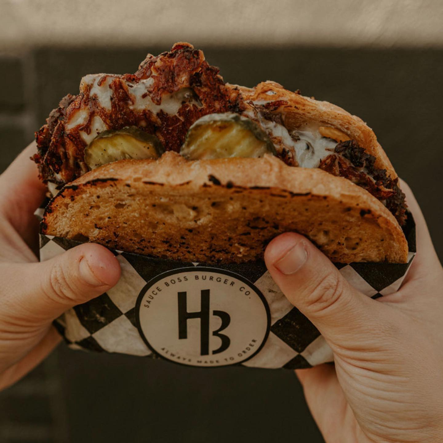 The Handlebar burger from Sauce Boss Burger Co.  Photo by @theturningpagephotoco
