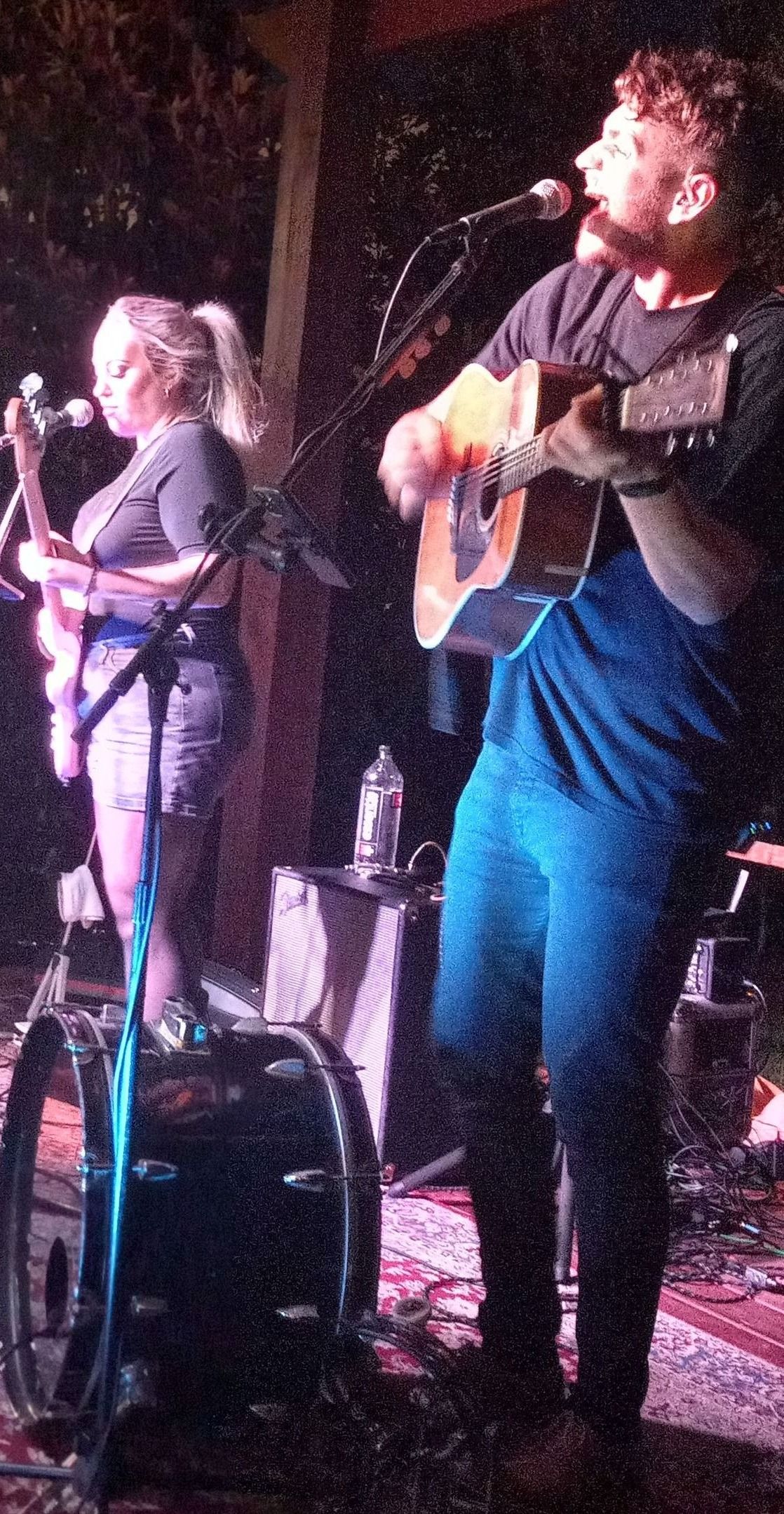 Mick keeps time, sings, and plays guitar while Kaylyn backs him up on bass