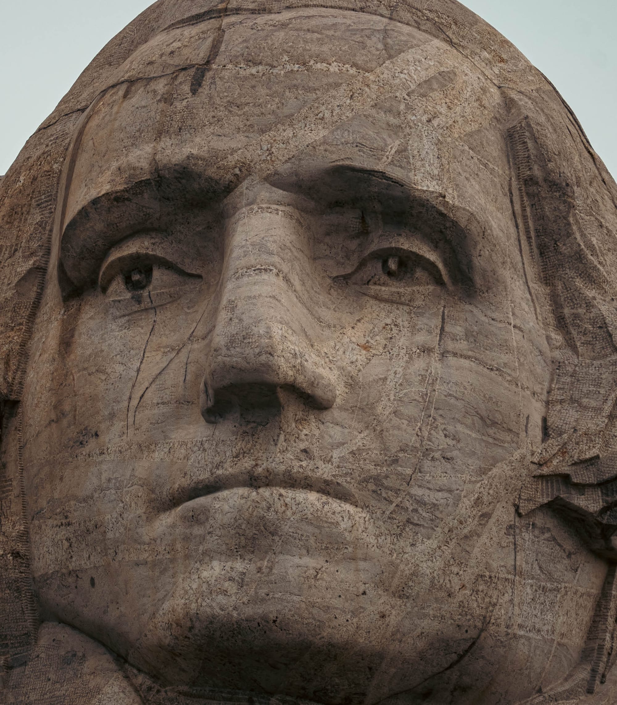 Close portrait of George Washington's granite face at Mount Rushmore National Memorial.