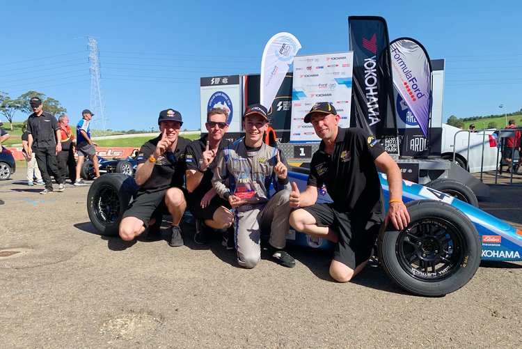 Tom Sargent celebrates his round victory with CHE Racing.