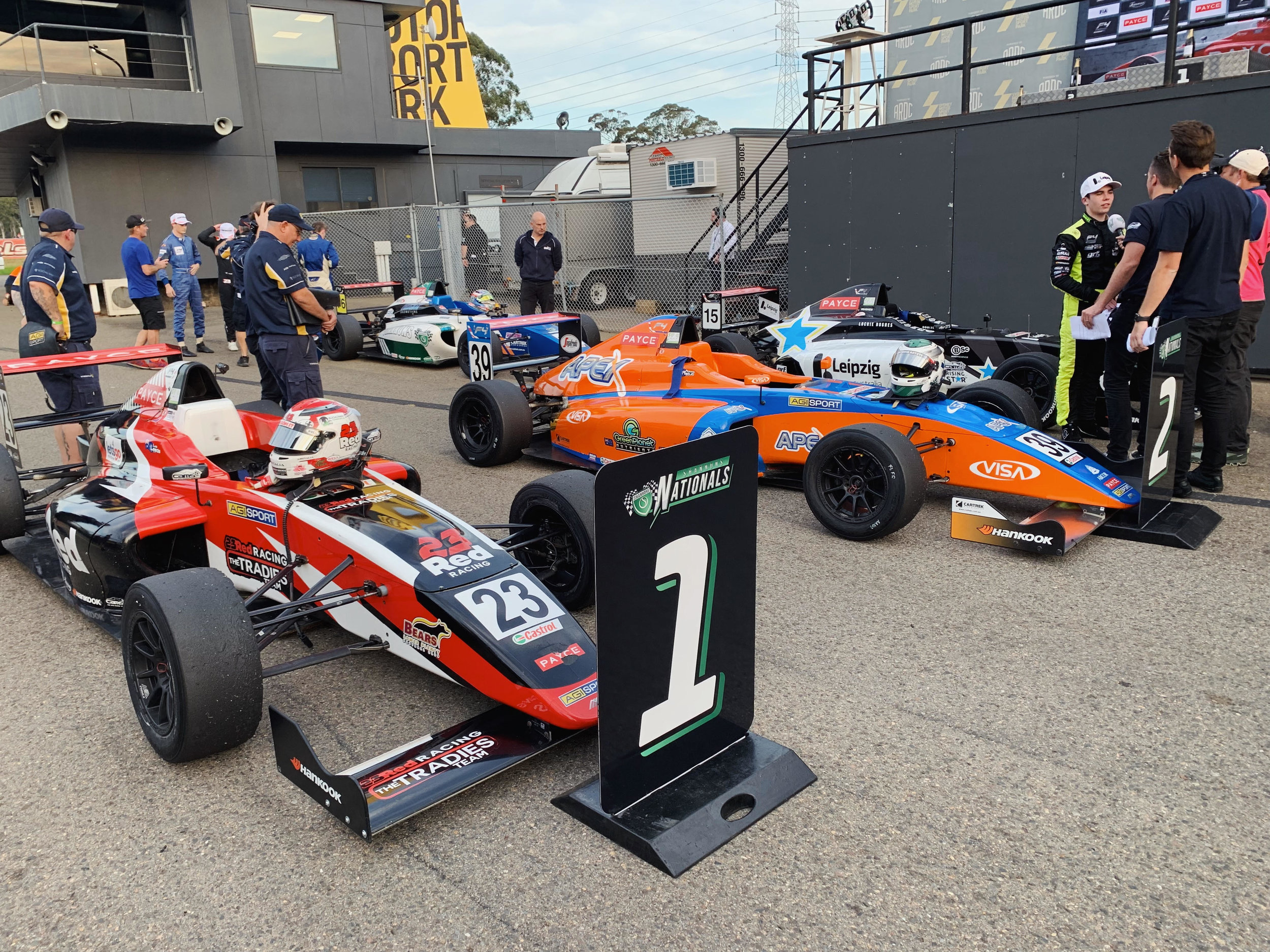 Parc ferme with the top 3 after the race.