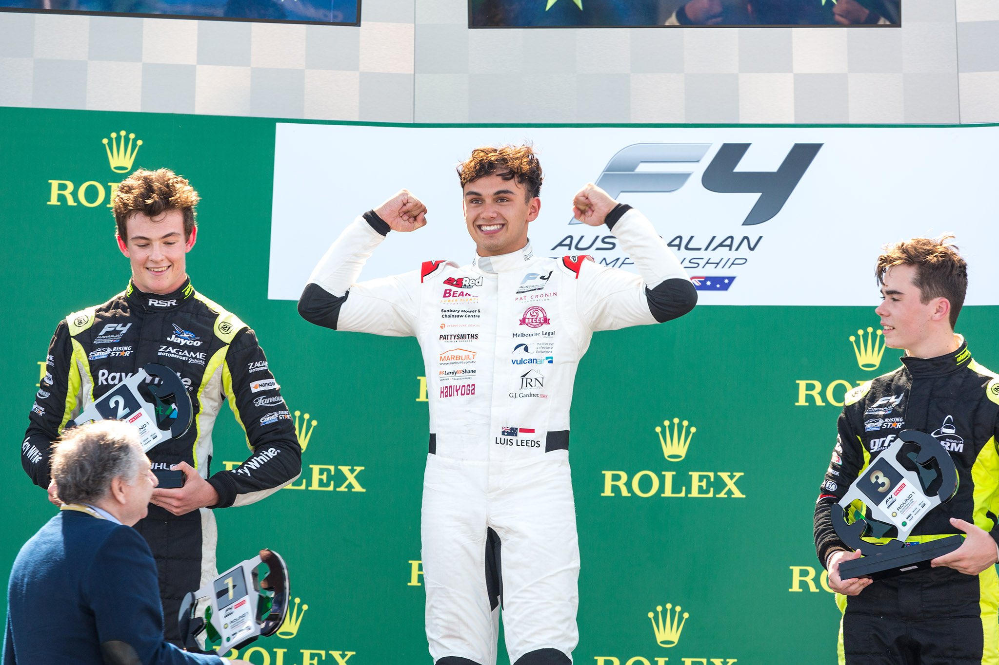 Luis Leeds celebrates a race victory at the Australian Grand Prix.