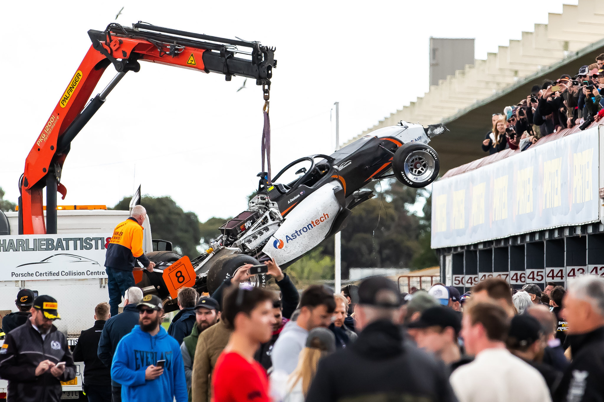 Alex Davison’s wrecked S5000 returns to the pits. Image: S5000