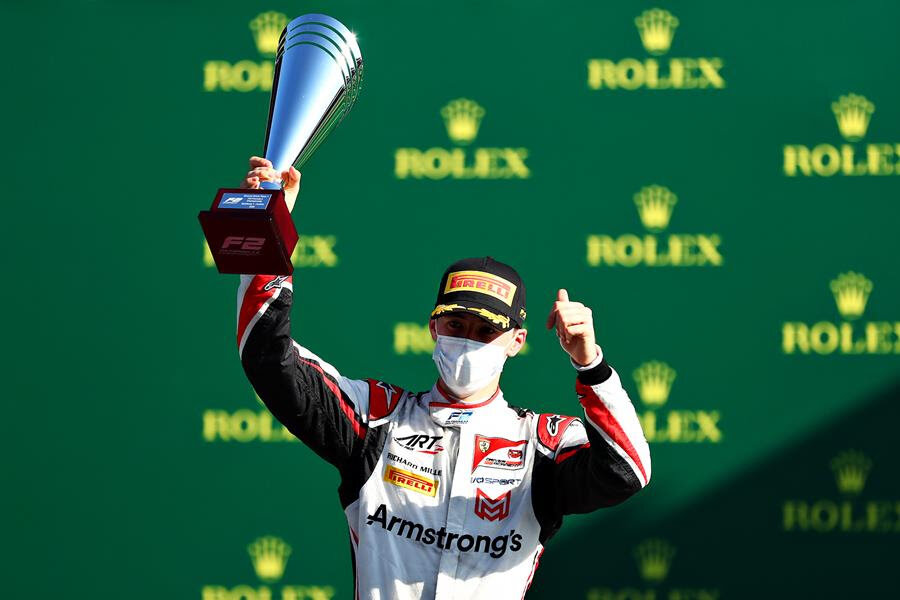Marcus Armstrong celebrates on the podium for the FIA Formula 2 Feature Race in Austria. (Image: Suplied/Formula Motorsport Limited)