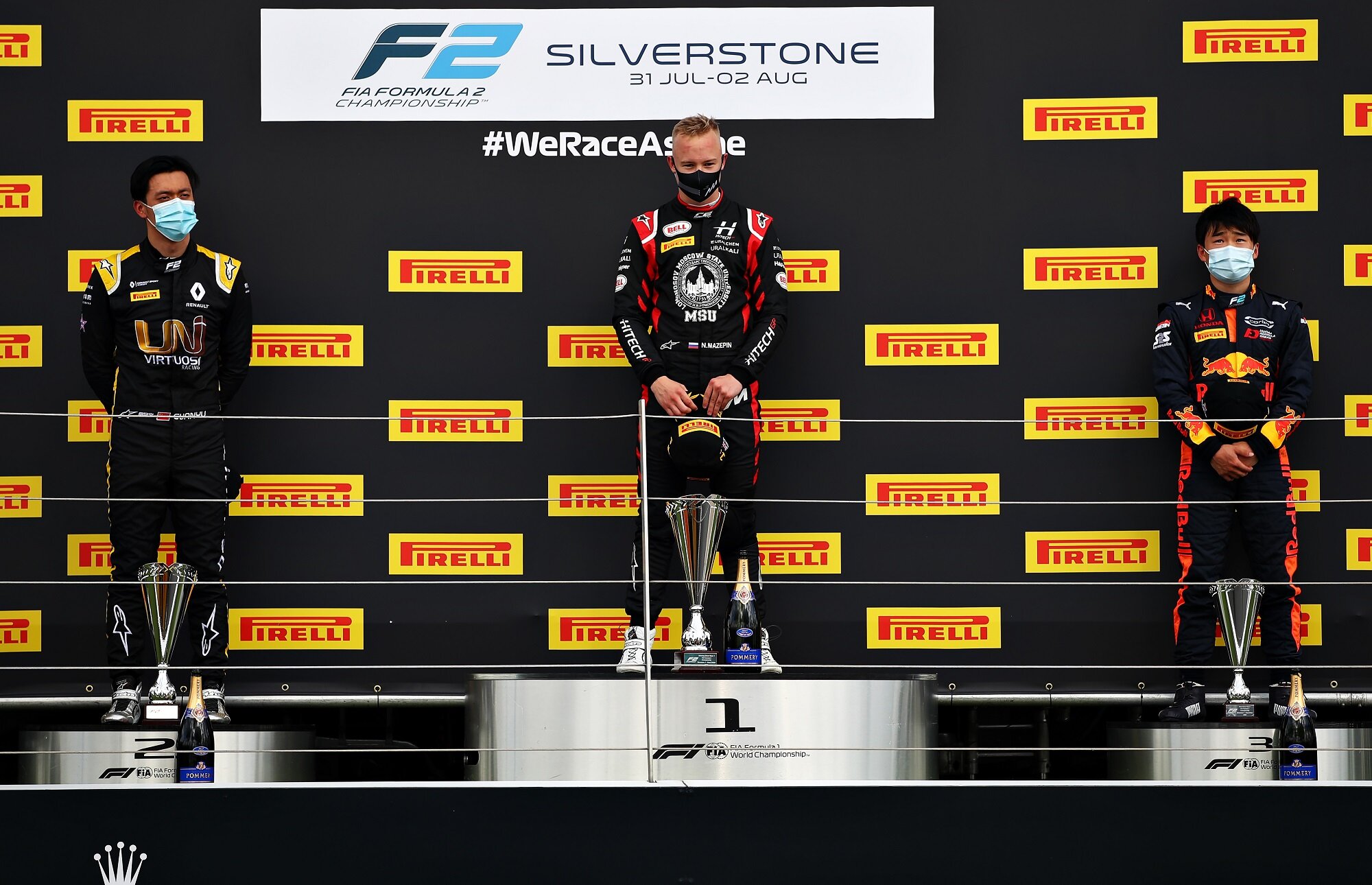 Guanyu Zhou, Nikita Mazepin, and Yuki Tsunoda stand on the FIA F2 podium for the Feature Race at Silverstone. (Image: Supplied/Formula Motorsport Limited)