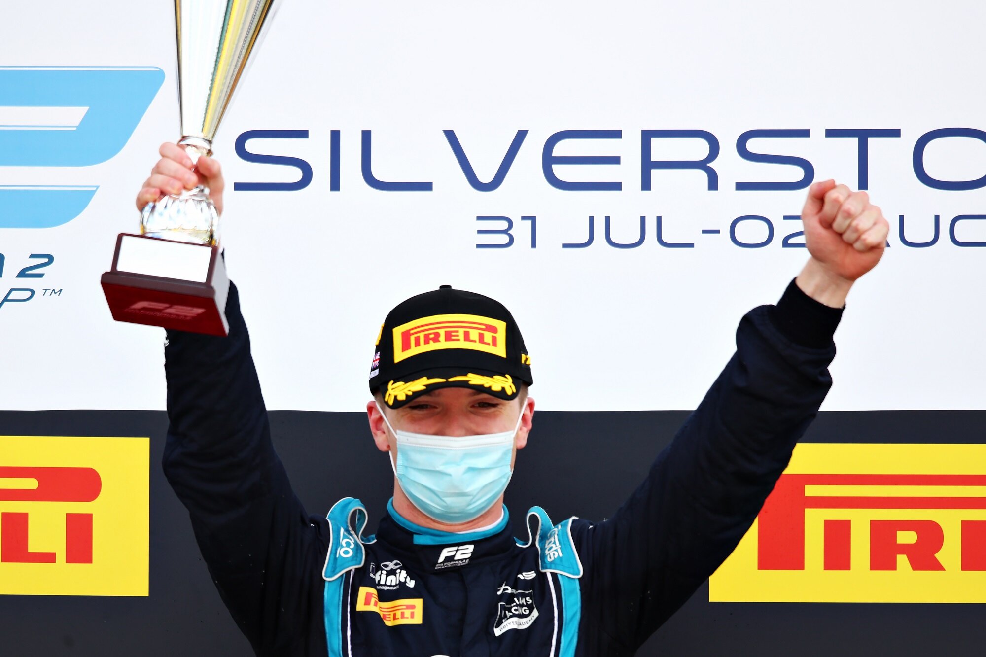 Dan Ticktum celebrates his maiden FIA Formula 2 race victory on the podium at Silverstone. (Image: Supplied/Formula Motorsport Limited)