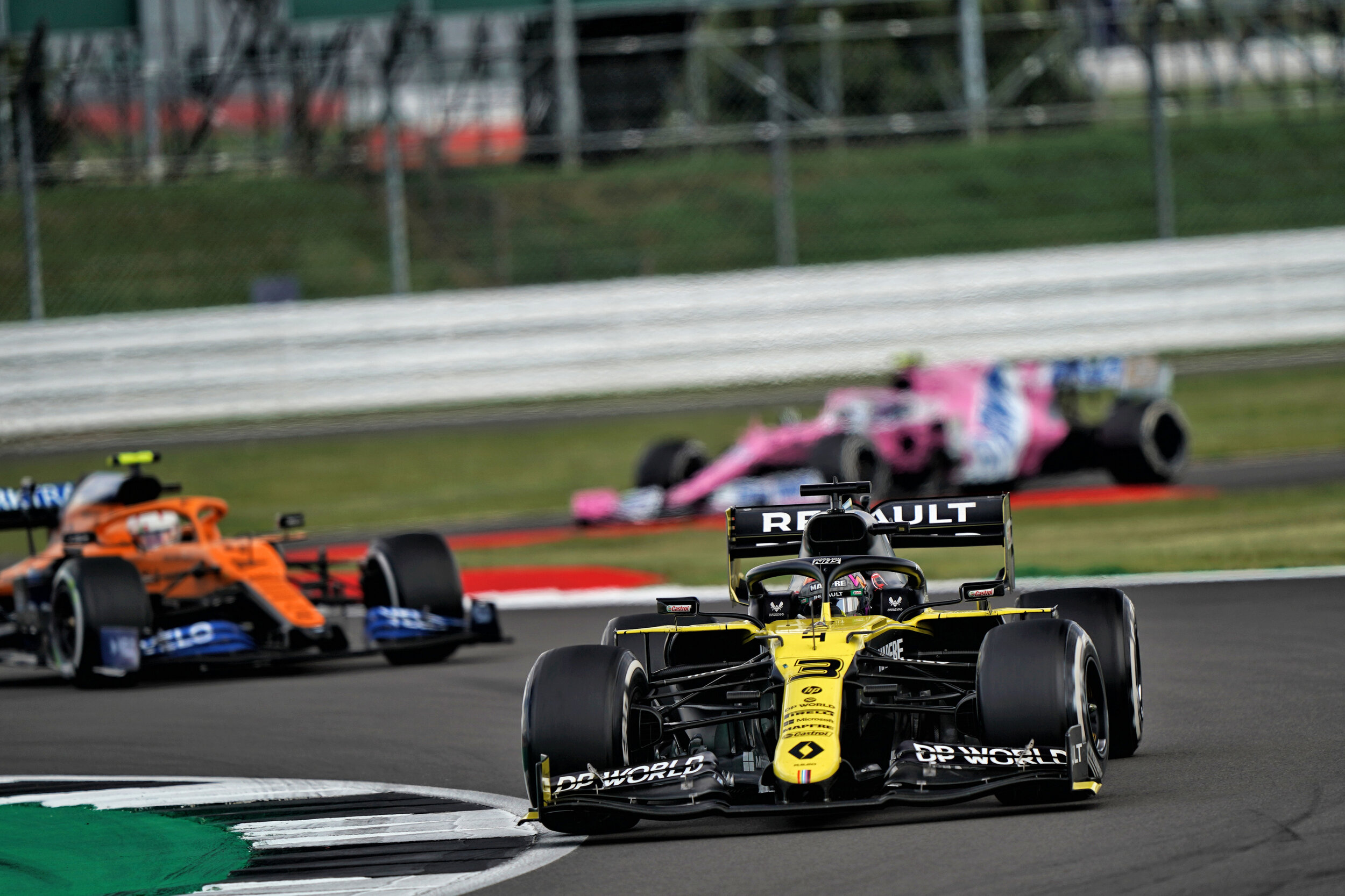 Daniel Ricciardo passes Lando Norris in the final stages of the British Grand Prix. (Image: Supplied)
