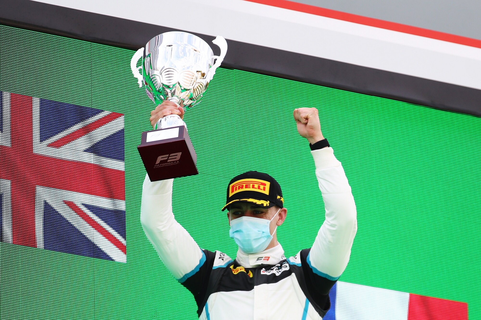 Jake Hughes celebrates his FIA Formula 3 victory on the podium at Monza. (Image: Supplied/Formula Motorsport Limited)