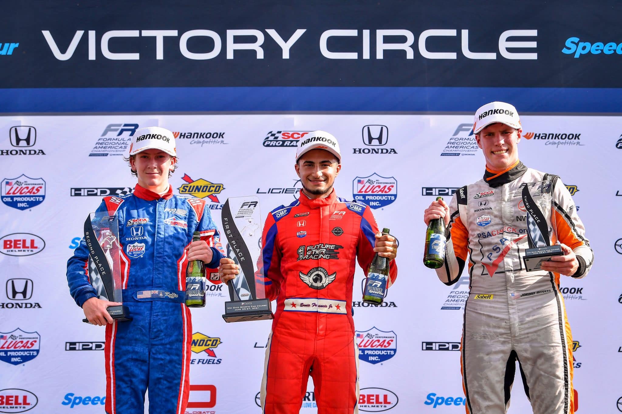 Ernie Francis Jr, Kyffin Simpson, and Jordan Missig celebrate on the podium for Race 3 at Mid-Ohio. (Kyffin Simpson)