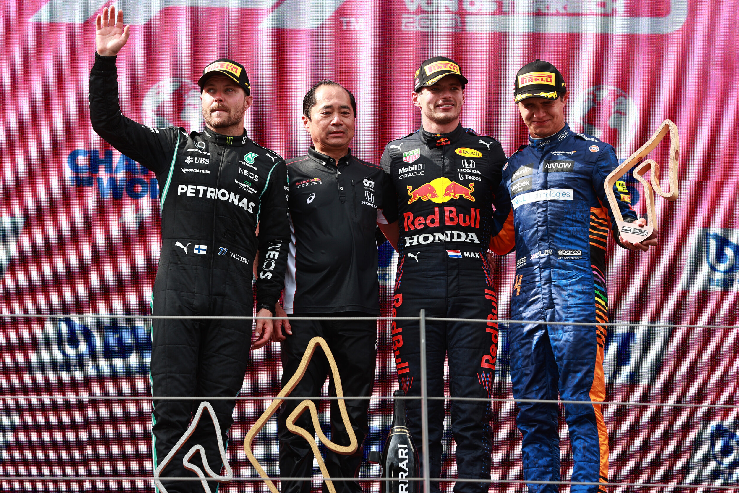 Max Verstappen, Lando Norris, Valtteri Bottas, and Toyoharu Tanabe on the podium in Austria. (Getty Images/Red Bull Content Pool)