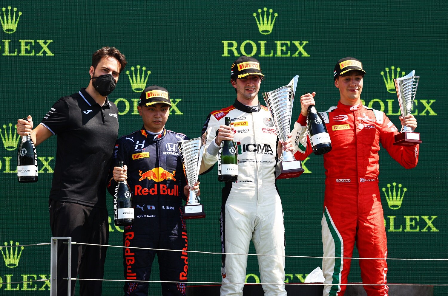 Lorenzo Colombo, Ayumu Iwasa, and Olli Caldwell on the podium in Hungary. (Formula Motorsport)