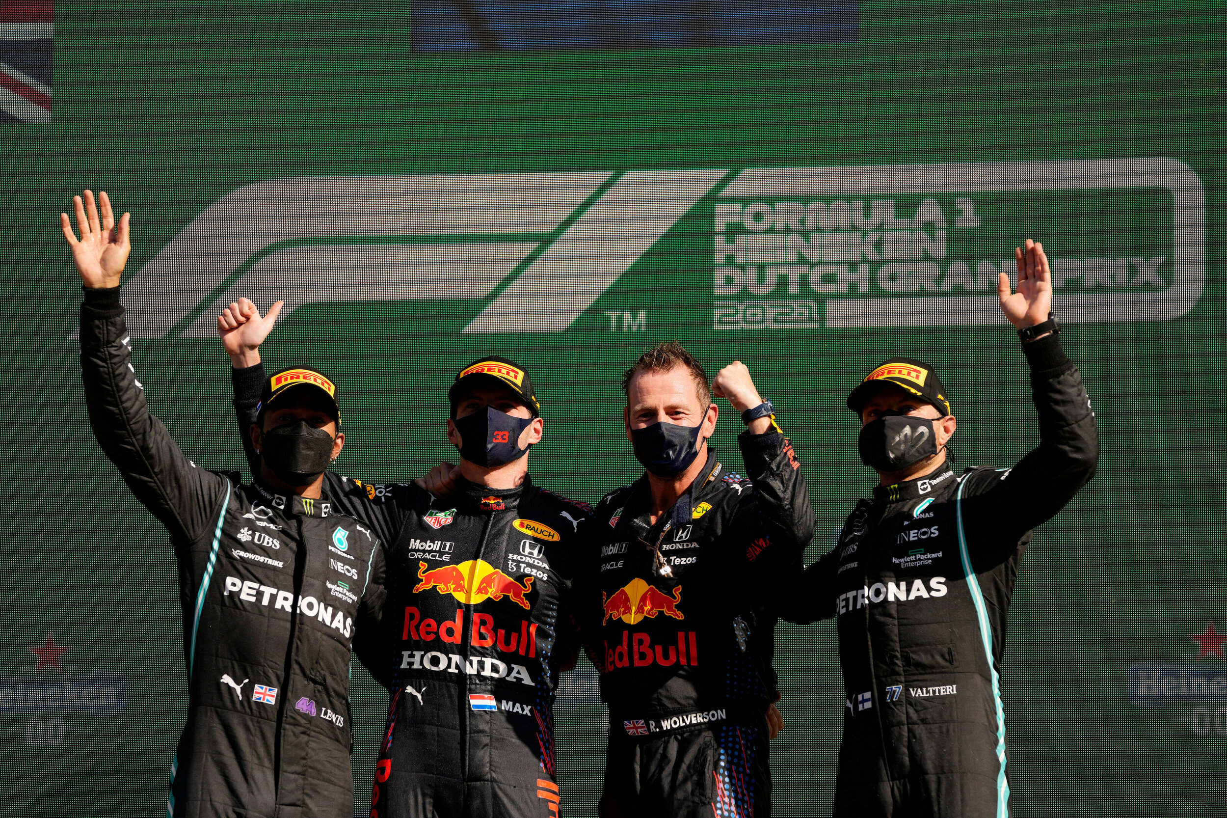 Max Verstappen, Lewis Hamilton, and Valtteri Bottas celebrate on the podium (Getty Images/Red Bull Content Pool)